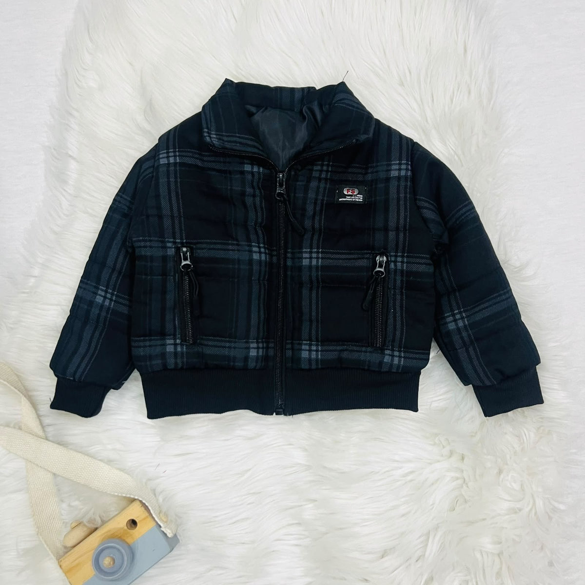 Cozy season, but make it cool. ⚡️ Keep your little one warm and effortlessly stylish in this plaid puffer jacket and cargo fleece winter pants set