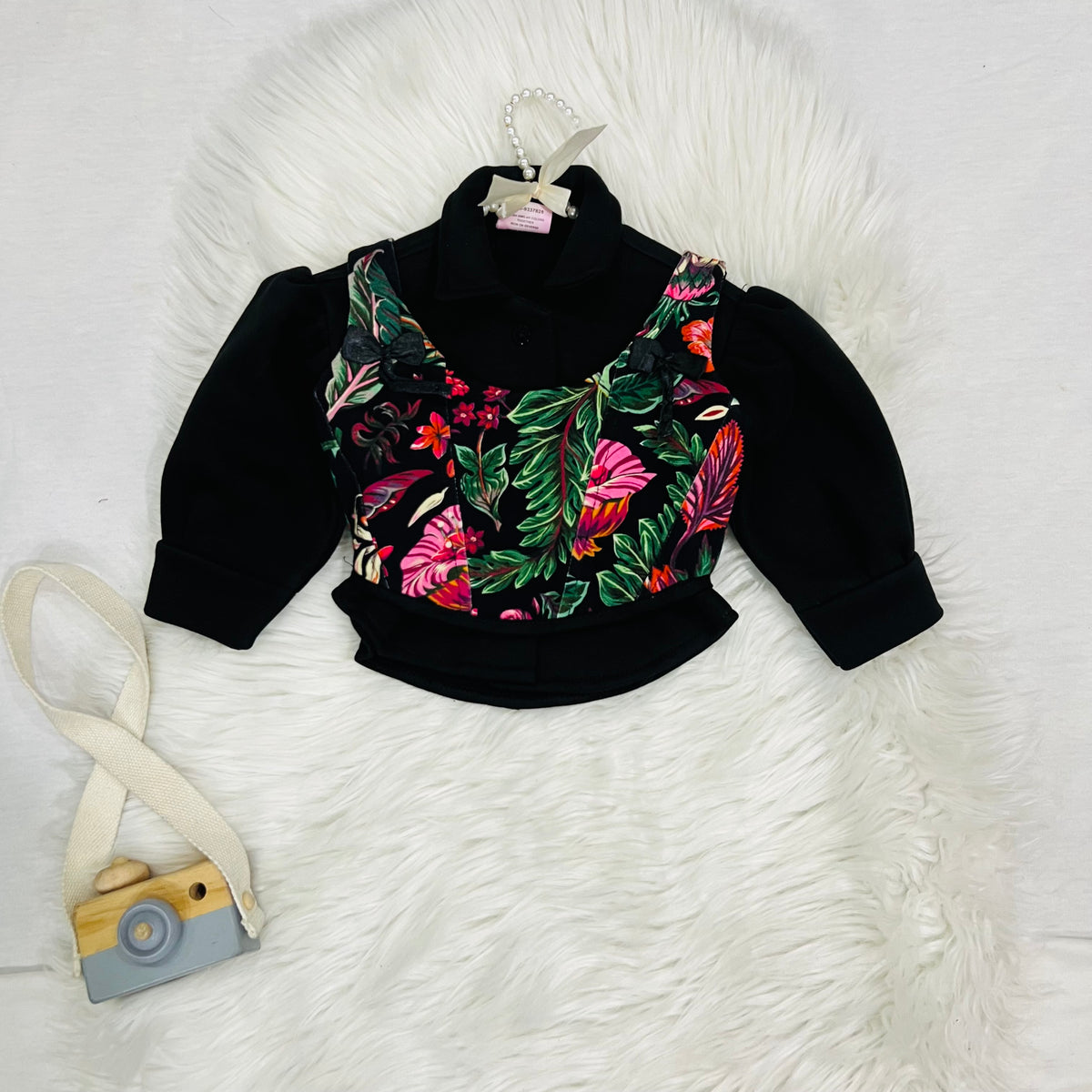 Effortless style meets vibrant tropical prints. Featuring a black long-sleeve top paired with a floral corset-style overlay, wide-leg trousers winter fleece stuff (Copy)