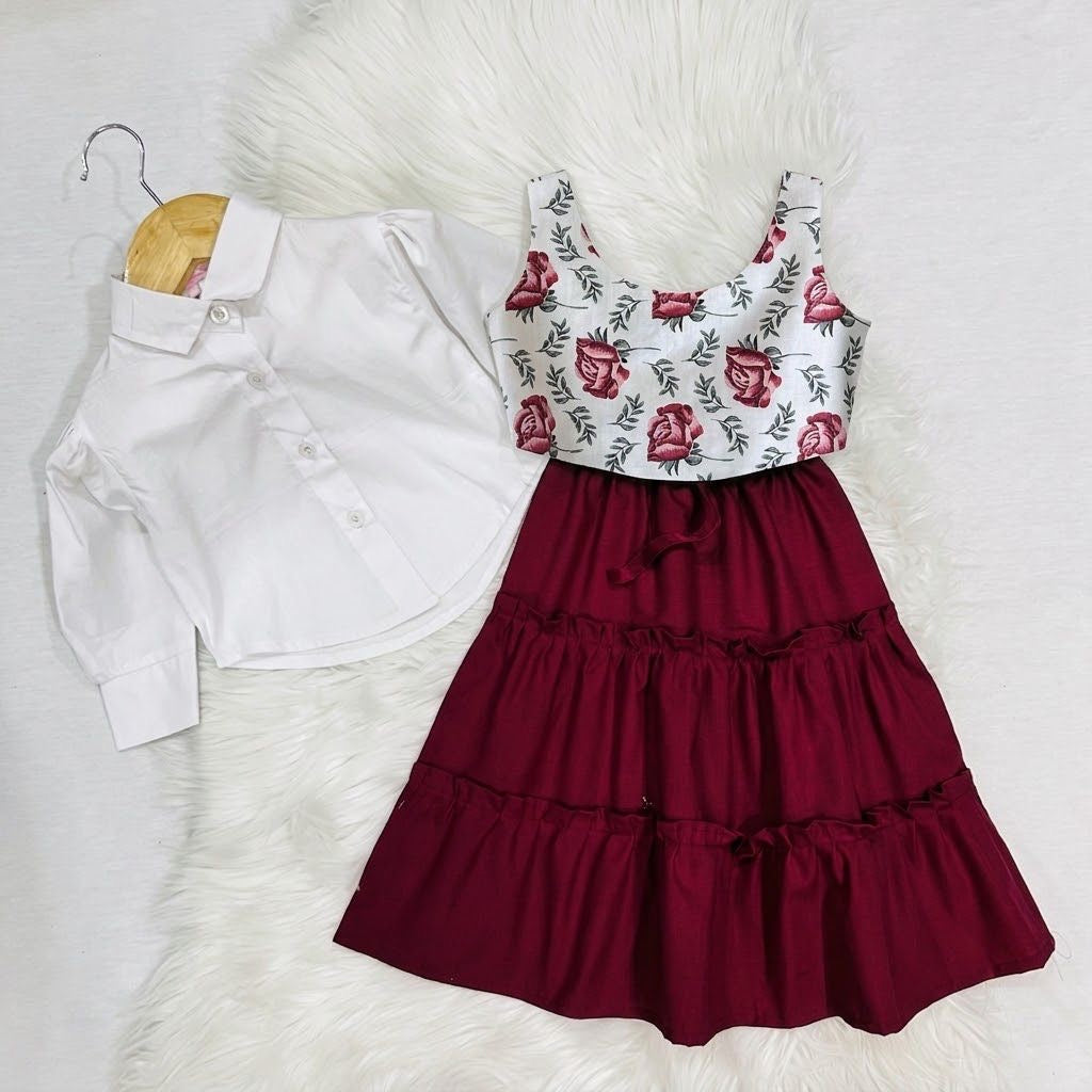 White Puff-sleeve Button-up Blouse Layered With White Floral Print Corest Top Paired With Vibrant Maroon Tiered Ruffle Skirt