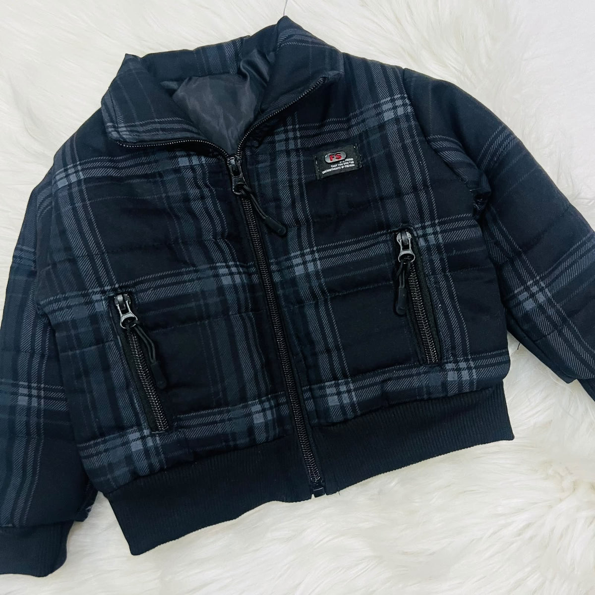 Cozy season, but make it cool. ⚡️ Keep your little one warm and effortlessly stylish in this plaid puffer jacket and cargo fleece winter pants set