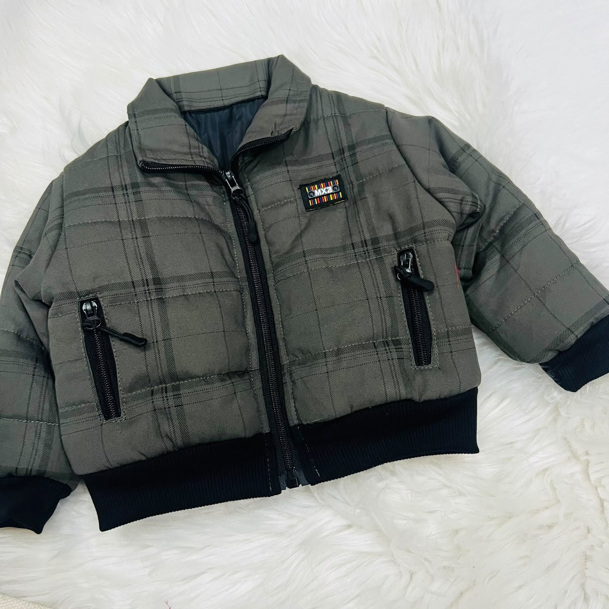 Cozy season, but make it cool. ⚡️ Keep your little one warm and effortlessly stylish in this plaid puffer jacket and cargo fleece winter pants set