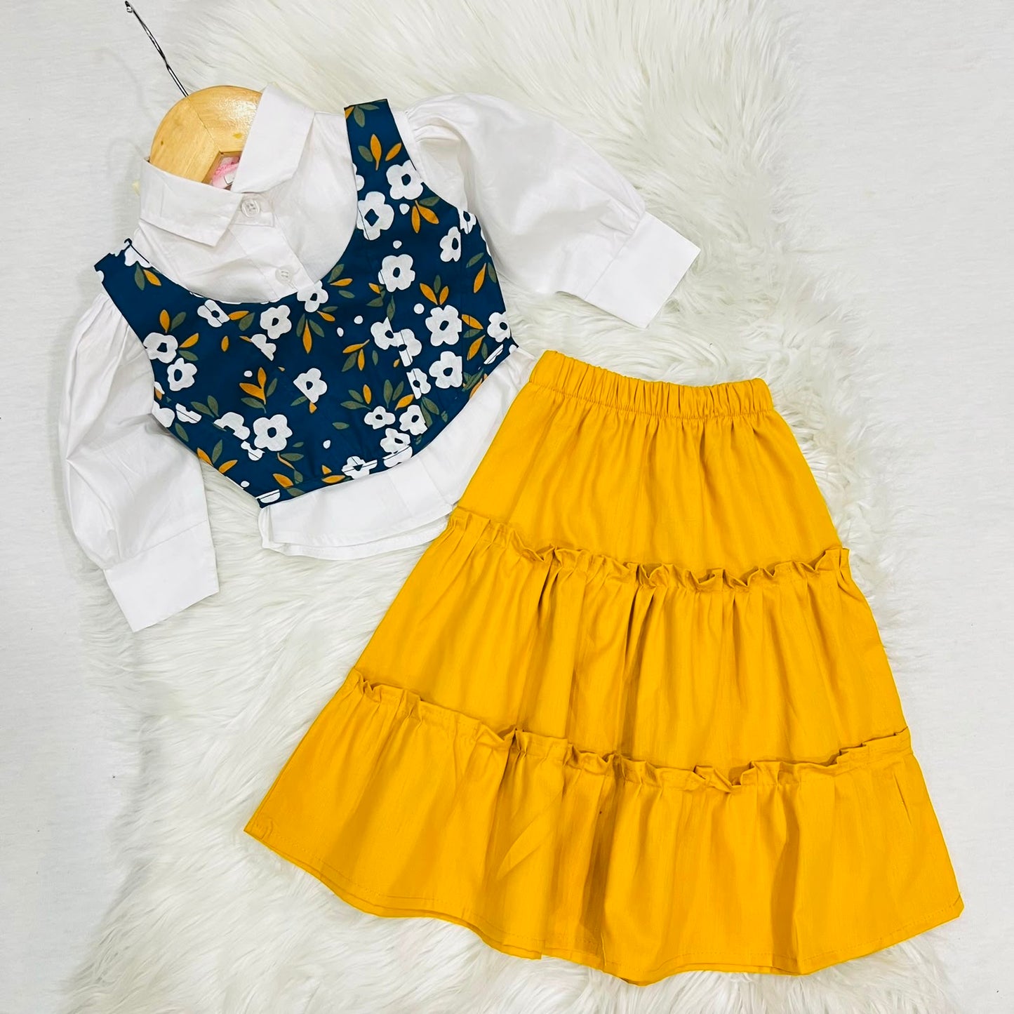 White Puff-sleeve Button-up Blouse Layered With Navy Blue Floral Print Corest Top Paired With Vibrant Yellow Tiered Ruffle Skirt
