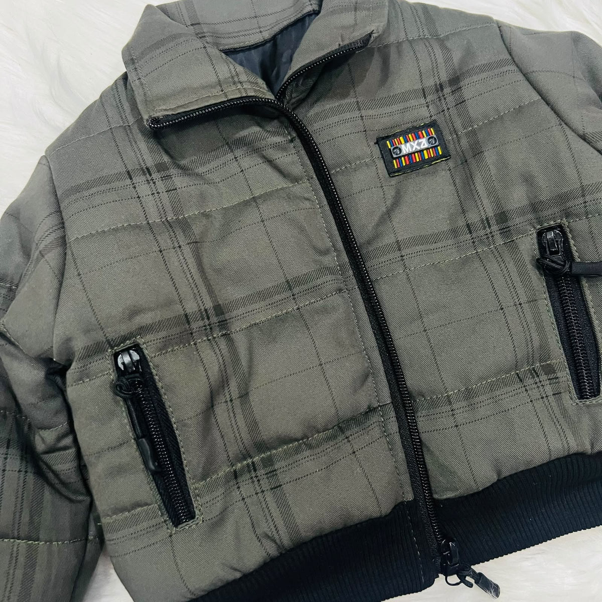 Cozy season, but make it cool. ⚡️ Keep your little one warm and effortlessly stylish in this plaid puffer jacket and cargo fleece winter pants set