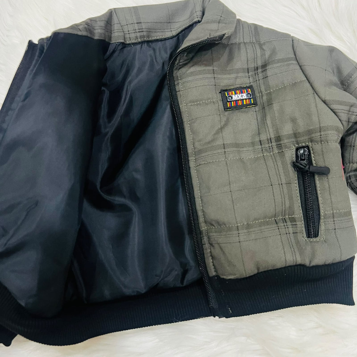 Cozy season, but make it cool. ⚡️ Keep your little one warm and effortlessly stylish in this plaid puffer jacket and cargo fleece winter pants set