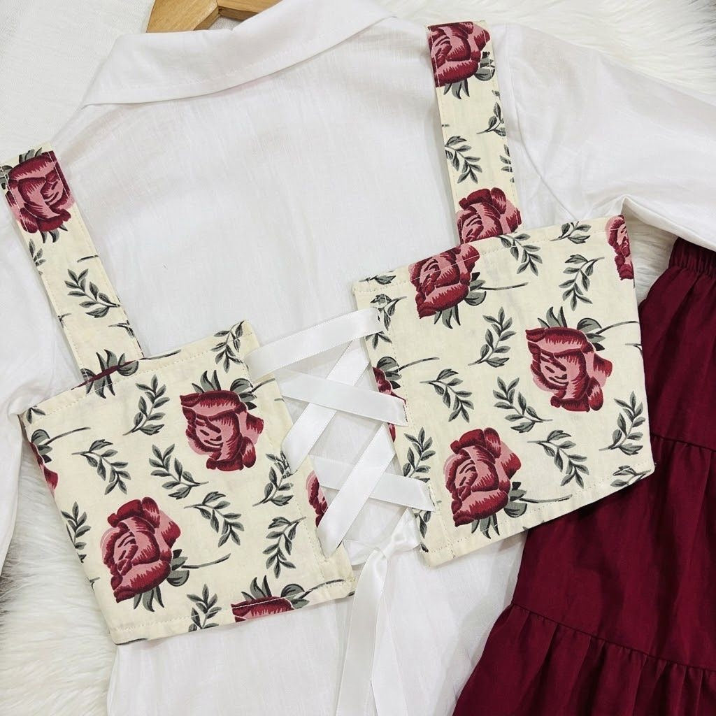 White Puff-sleeve Button-up Blouse Layered With White Floral Print Corest Top Paired With Vibrant Maroon Tiered Ruffle Skirt