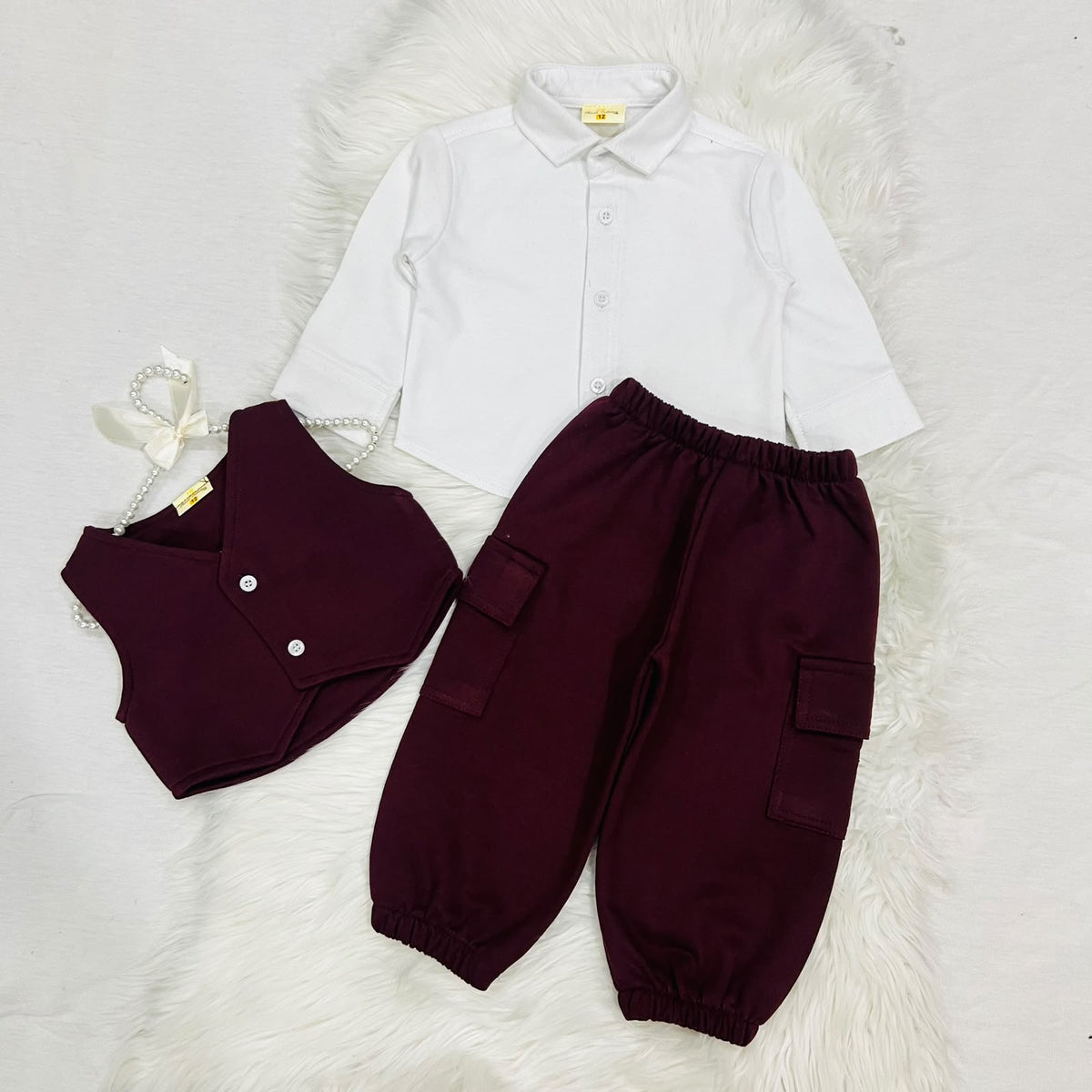 The ultimate 3-piece formal set: crisp white collared shirt, burgundy vest, and matching cargo trousers