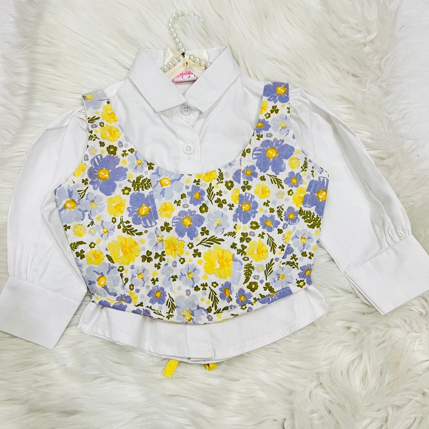 White Puff-sleeve Button-up Blouse Layered With White Floral Print Corest Top Paired With Vibrant Yellow Tiered Ruffle Skirt