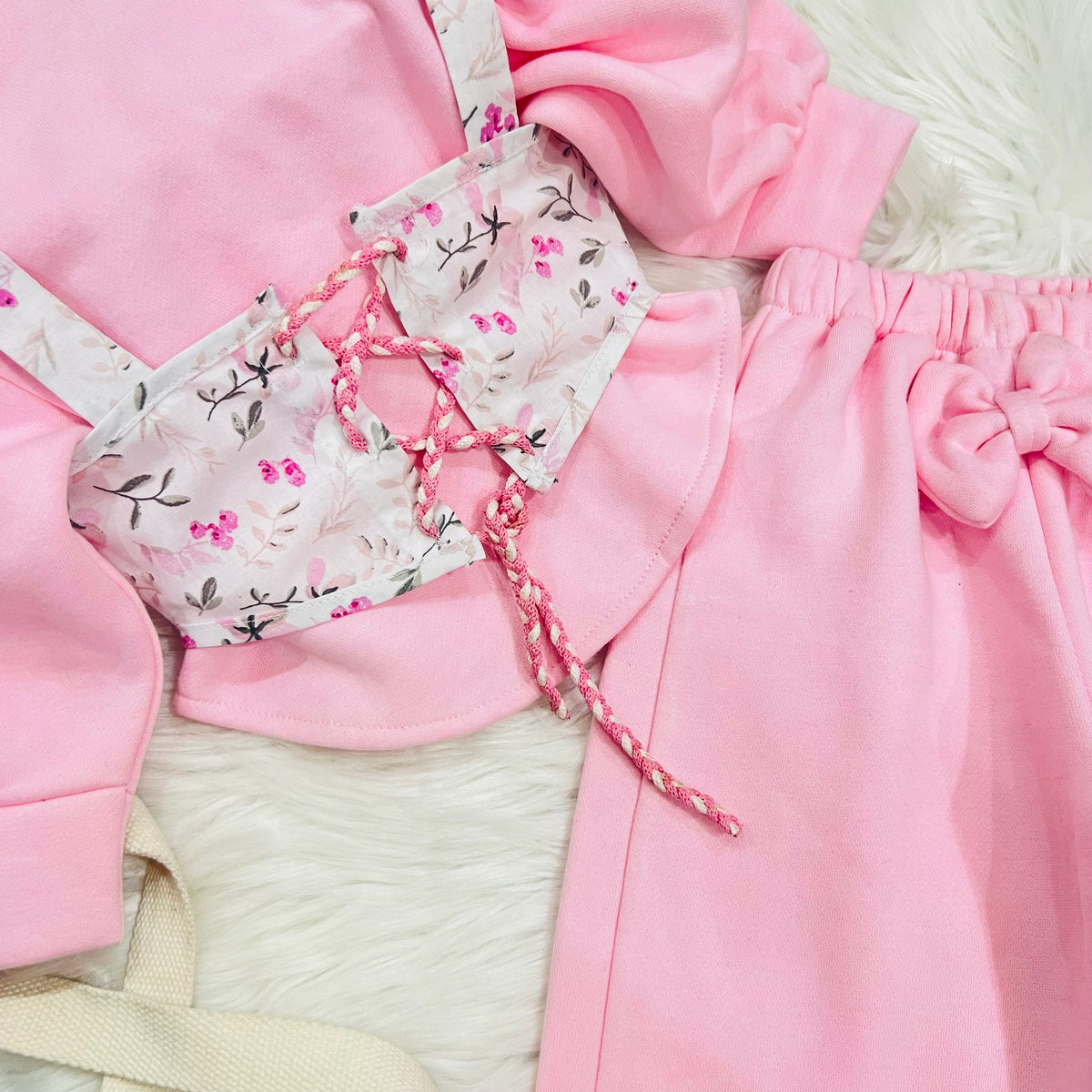 🎀 Keep your little princess warm and stylish with this adorable pink fleece three piece set, featuring a delicate floral corset-style overlay and cute bow details fleece stuff