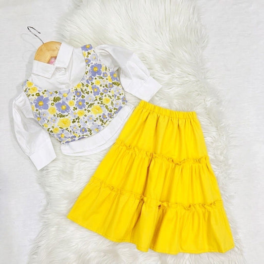 White Puff-sleeve Button-up Blouse Layered With White Floral Print Corest Top Paired With Vibrant Yellow Tiered Ruffle Skirt