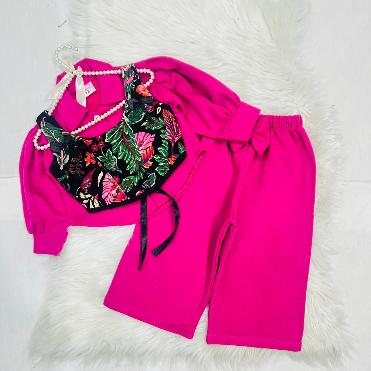 Effortless style meets vibrant tropical prints. Featuring a bright pink long-sleeve top paired with a floral corset-style overlay, wide-leg trousers winter fleece stuff (Copy 3)