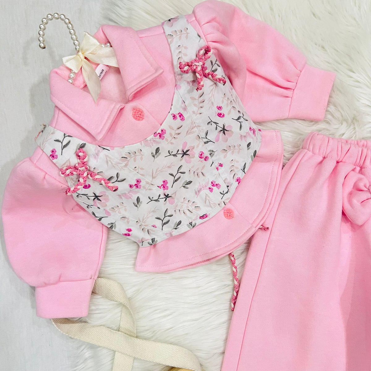 🎀 Keep your little princess warm and stylish with this adorable pink fleece three piece set, featuring a delicate floral corset-style overlay and cute bow details fleece stuff