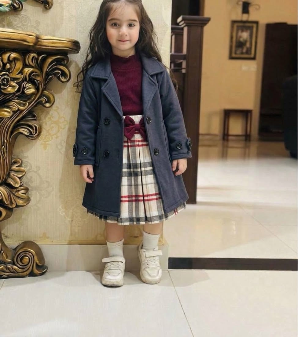 "Classy charcoal  grey trench-style blazer jacket dress paired with a beige plaid skirt."
 "Stylish girls' 2-piece layered outfit set featuring a double-breasted  charcoal grey coat and plaid pleated skirt."fleece stuff winter