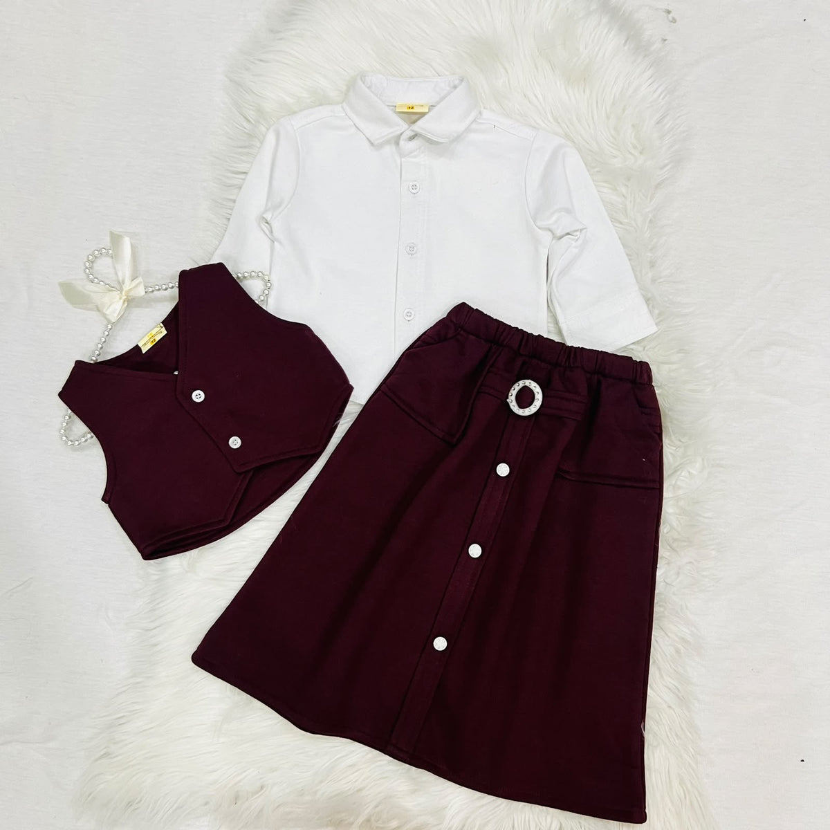 The ultimate 3-piece formal set: crisp white collared shirt, burgundy vest, and matching  long  skirt fleece stuff