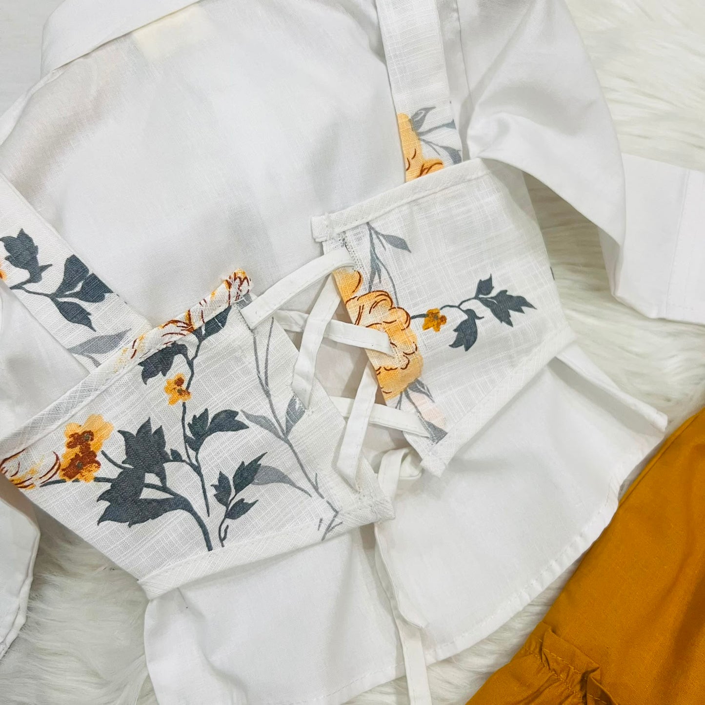 White Puff-sleeve Button-up Blouse Layered With White Floral Print Corest Top Paired With Vibrant  Mustarad Tiered Ruffle Skirt