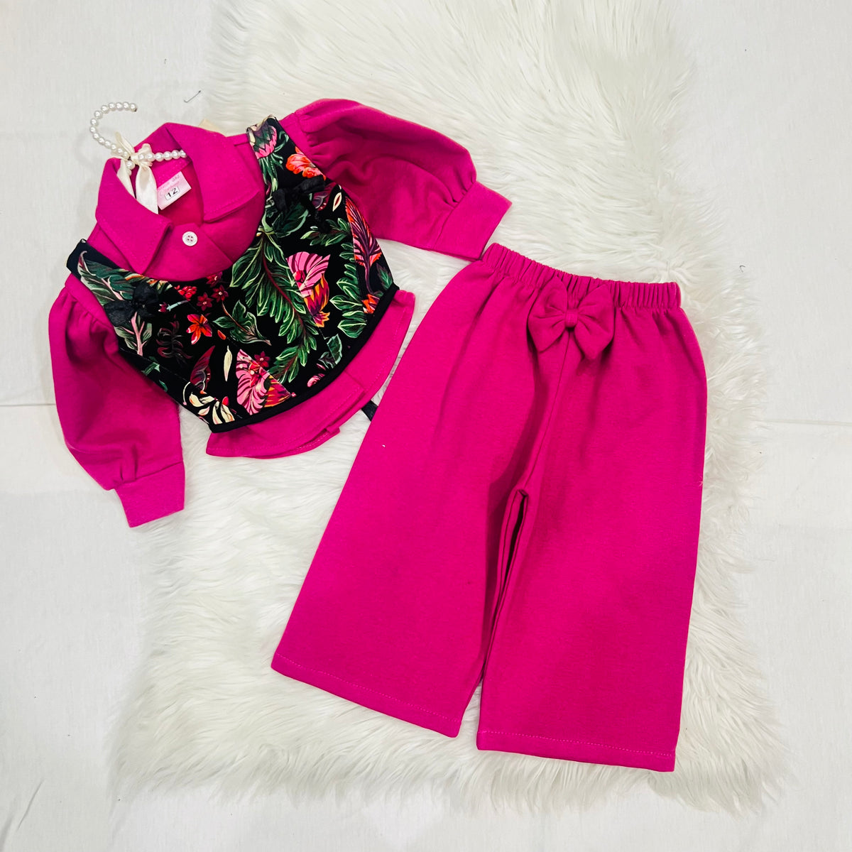 Effortless style meets vibrant tropical prints. Featuring a bright pink long-sleeve top paired with a floral corset-style overlay, wide-leg trousers winter fleece stuff (Copy 3)