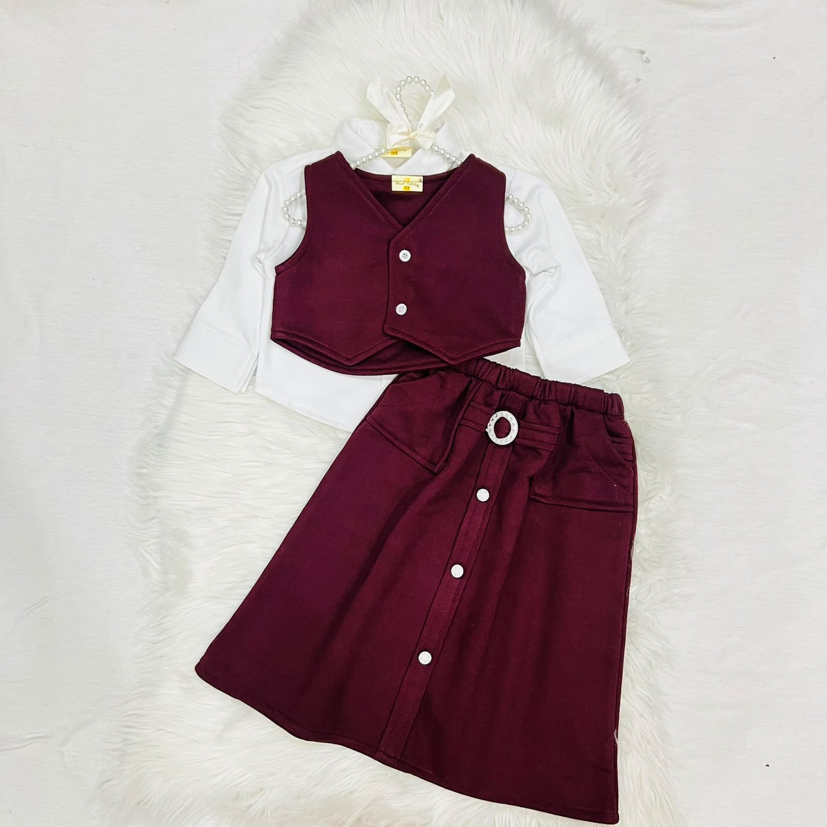 The ultimate 3-piece formal set: crisp white collared shirt, burgundy vest, and matching  long  skirt fleece stuff