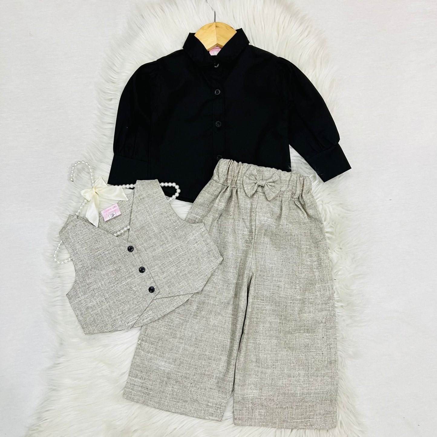 Girls' 3-piece outfit featuring a black long-sleeve button-down shirt paired with an beige textured button vest and matching wide-leg trousers cotton stuff