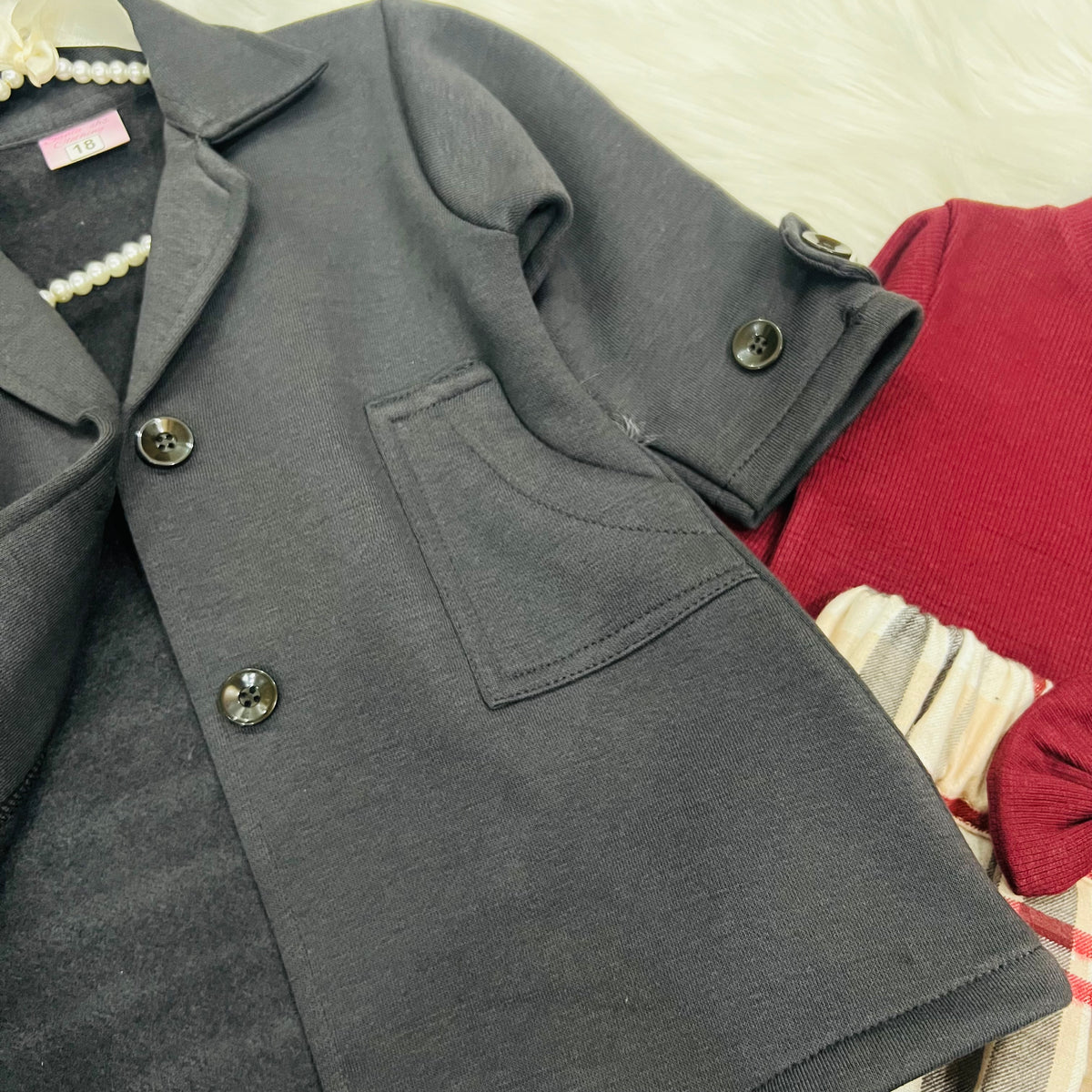 "Classy charcoal  grey trench-style blazer jacket dress paired with a beige plaid skirt."
 "Stylish girls' 2-piece layered outfit set featuring a double-breasted  charcoal grey coat and plaid pleated skirt."fleece stuff winter