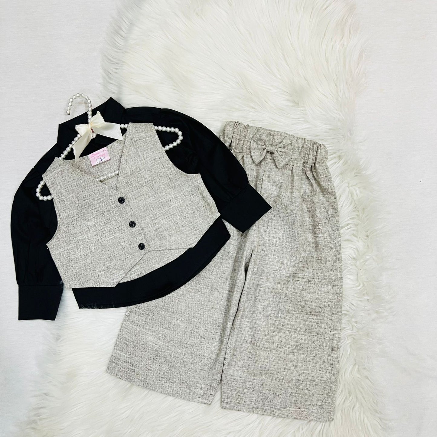 Girls' 3-piece outfit featuring a black long-sleeve button-down shirt paired with an beige textured button vest and matching wide-leg trousers cotton stuff