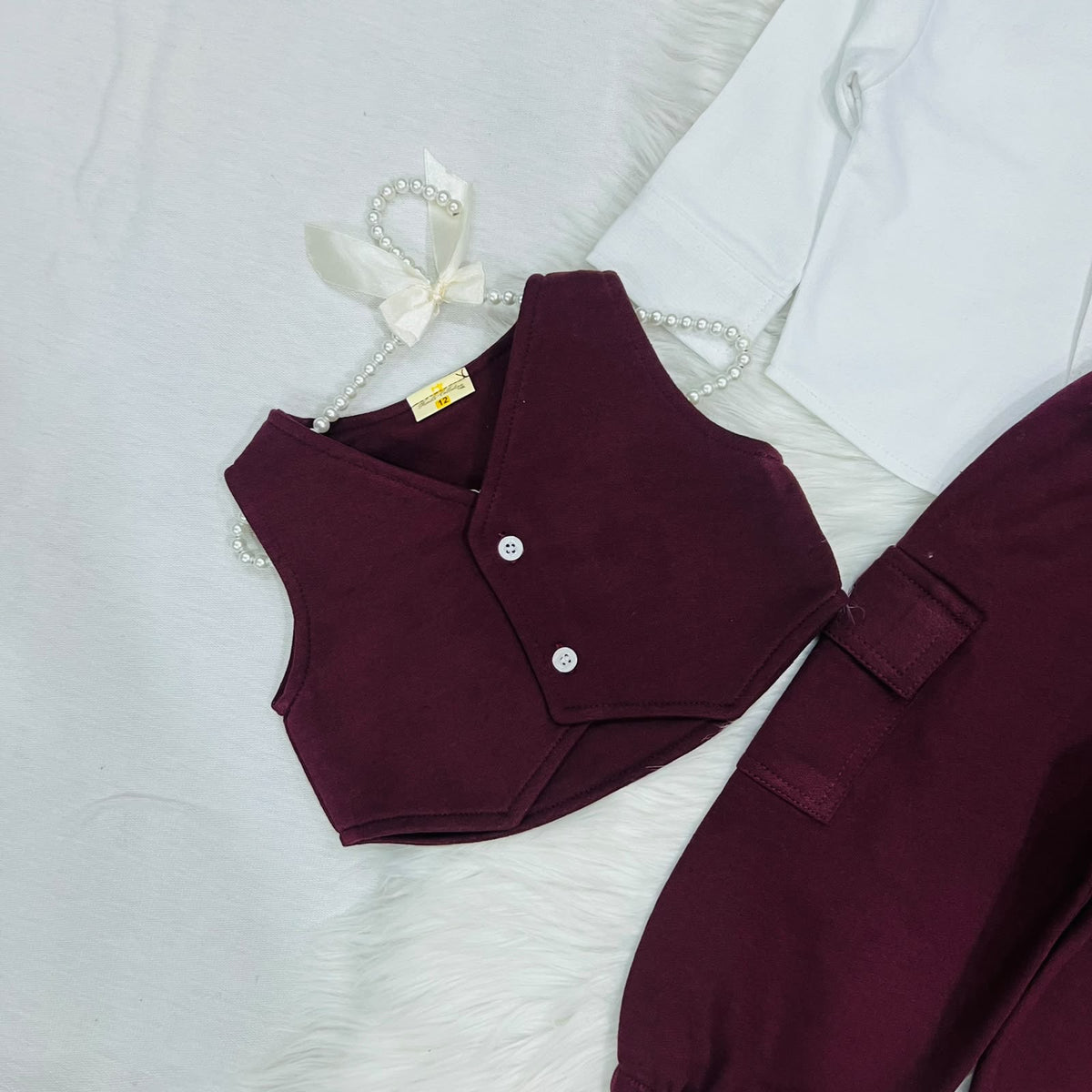 The ultimate 3-piece formal set: crisp white collared shirt, burgundy vest, and matching cargo trousers