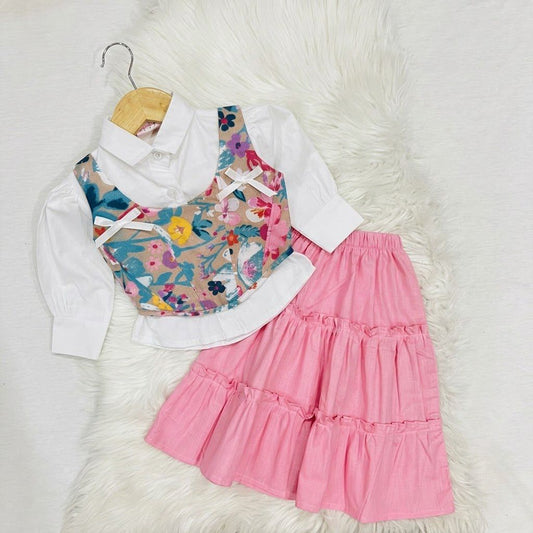 White Button-down Shirt Layered With Vibrant, Multicolored Floral Corest Top & Paired With Tiered Baby Pink Ruffled Skirt Cotton Stuff