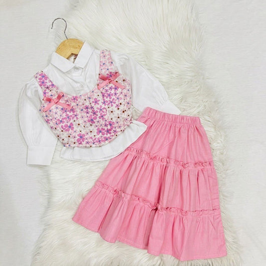 White Button-down Shirt Layered With Vibrant, Multicolored Floral Corest Top & Paired With Tiered Baby Pink Skirt Cotton Stuff
