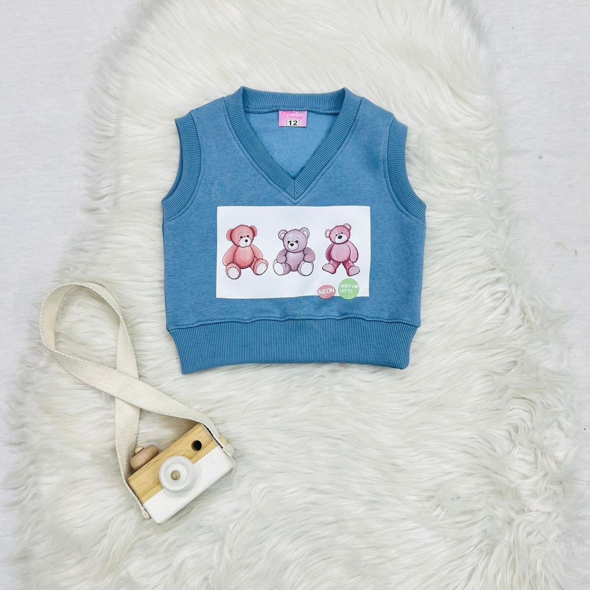 Piece baby and toddler outfit set featuring a light blue knitted bear vest, a white long-sleeve top, and matching blue trousers. Fleece stuff