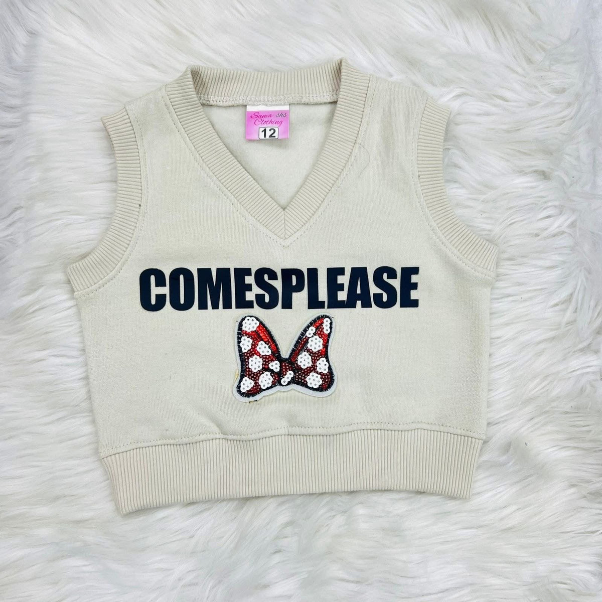Three-piece children's clothing set with a black long-sleeve top, a cream-colored knit vest, and matching cream-colored cargo jogger pants. Fleece stuff
