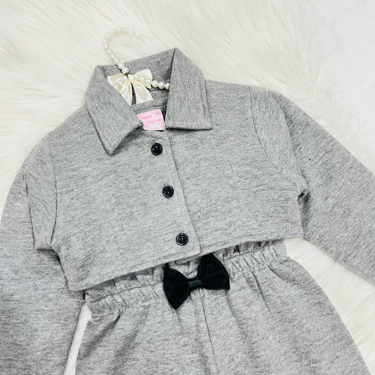 Gray two-piece baby girl outfit featuring a sleeveless romper with a black bow and a matching long-sleeve button-down jacket fleece winter stuff