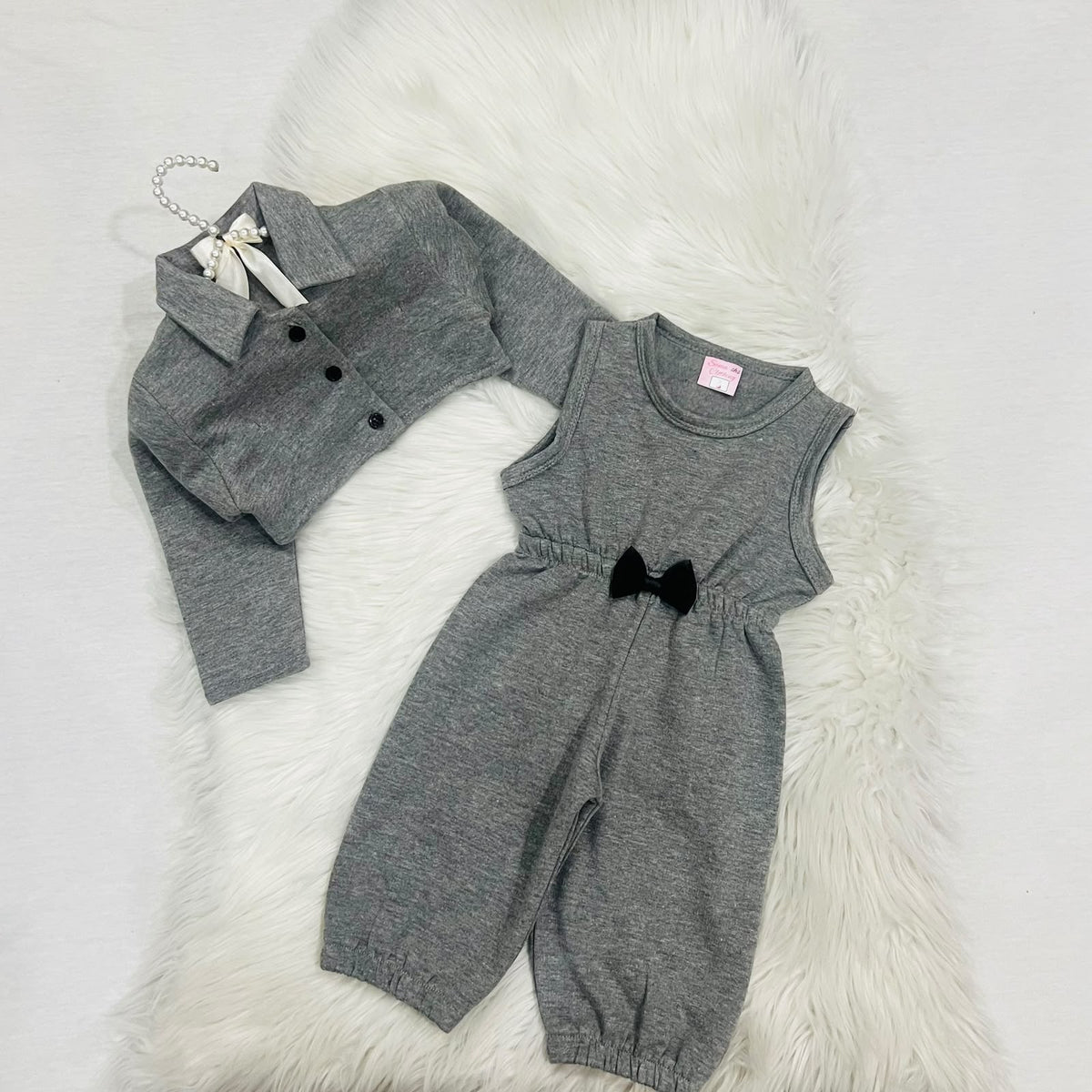 Gray two-piece baby girl outfit featuring a sleeveless romper with a black bow and a matching long-sleeve button-down jacket fleece winter stuff